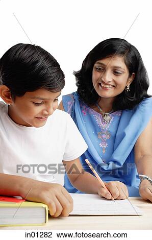Mother watching son do homework View Large Photo Image Stock Image - Mother watching son do homework. Fotosearch