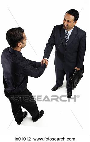 Two businessmen shaking hands View Large Photo Image Stock Image - Two businessmen shaking hands. Fotosearch