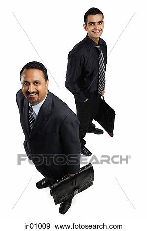 Two businessmen with briefcases, smiling at camera View Large Photo Image Stock Photo - Two businessmen with briefcases, smiling at camera. Fotosearch