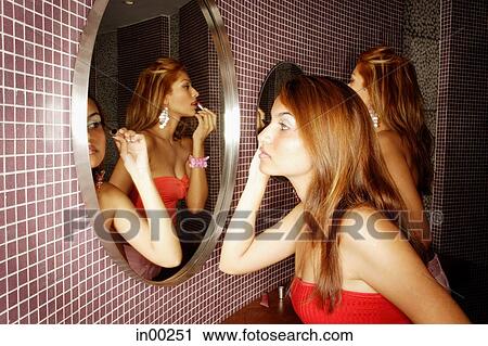 Two women in public restroom, applying make-up View Large Photo Image Stock Image - Two women in public restroom, applying make-up. Fotosearch
