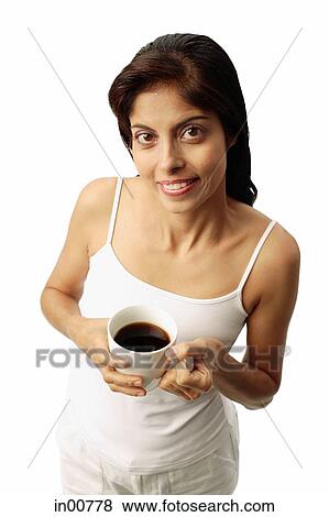 Woman holding cup of coffee View Large Photo Image Stock Photo - Woman holding cup of coffee. Fotosearch