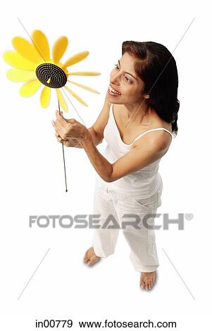 Woman holding pinwheel View Large Photo Image Stock Photo - Woman holding pinwheel. Fotosearch