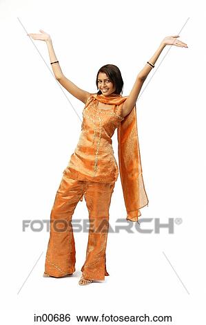Woman in Indian clothing, arms outstretched View Large Photo Image Stock Photograph - Woman in Indian clothing, arms outstretched. Fotosearch