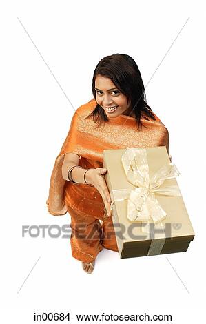 Woman in Indian clothing, holding gift box View Large Photo Image Picture - Woman in Indian clothing, holding gift box. Fotosearch