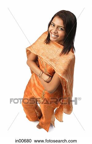 Woman in Indian clothing, smiling at camera View Large Photo Image Stock Image - Woman in Indian clothing, smiling at camera. Fotosearch