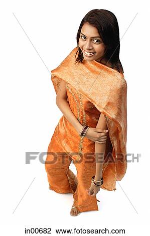 Woman in Indian clothing, smiling at camera View Large Photo Image Stock Image - Woman in Indian clothing, smiling at camera. Fotosearch