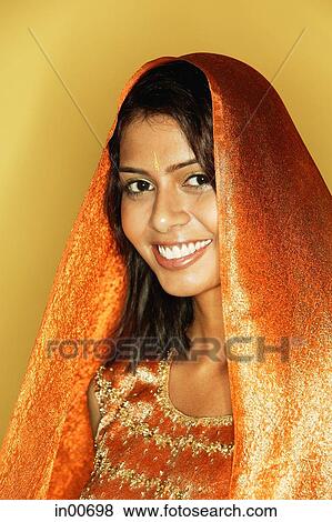 Stock Photo - Woman in Indian clothing, smiling, head shot. Fotosearch