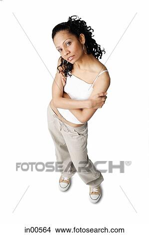 Woman looking at camera, arms crossed View Large Photo Image Picture - Woman looking at camera, arms crossed. Fotosearch