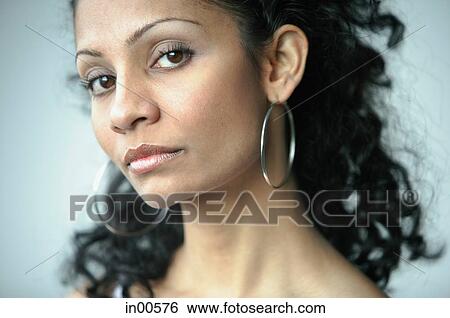 Stock Photograph - Woman looking at camera, portrait. Fotosearch