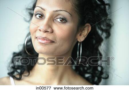 Woman looking at camera, smiling View Large Photo Image Stock Photo - Woman looking at camera, smiling. Fotosearch