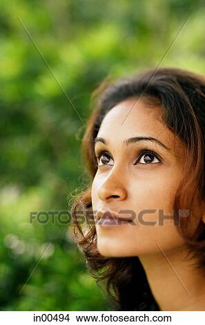 Woman looking away, head shot View Large Photo Image Picture - Woman looking away, head shot. Fotosearch