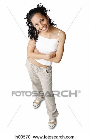 Woman looking up at camera, arms crossed View Large Photo Image Stock Image - Woman looking up at camera, arms crossed. Fotosearch