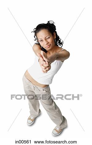 Stock Image - Woman pointing fingers at camera, squinting. Fotosearch