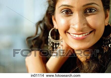 Picture - Woman smiling at camera, portrait. Fotosearch