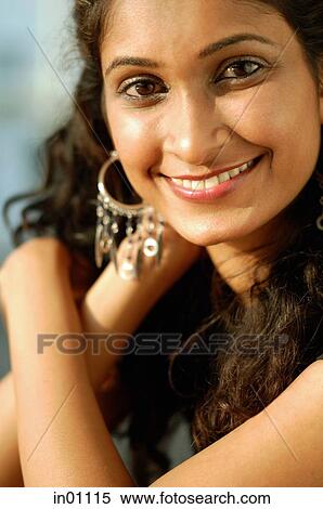 Woman smiling at camera, portrait View Large Photo Image Stock Photography - Woman smiling at camera, portrait. Fotosearch