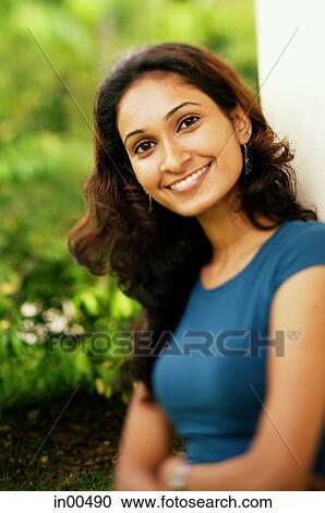 Woman smiling at camera View Large Photo Image Stock Image - Woman smiling at camera. Fotosearch