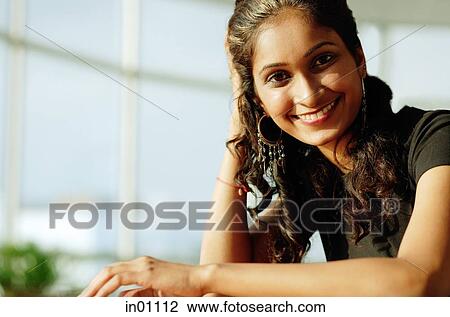Woman smiling at camera View Large Photo Image Stock Image - Woman smiling at camera. Fotosearch