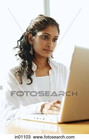 Woman using laptop View Large Photo Image Stock Image - Woman using laptop. Fotosearch