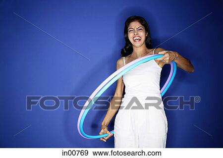 Woman with hoola hoop View Large Photo Image Stock Photo - Woman with hoola hoop. Fotosearch