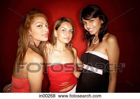 Stock Photo - Women looking at camera, portrait. Fotosearch