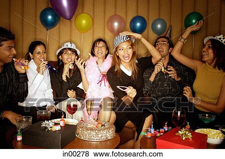 Young adults celebrating birthday View Large Photo Image Stock Photo - Young adults celebrating birthday. Fotosearch