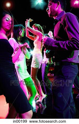 Young adults in club dancing face to face View Large Photo Image Stock Photo - Young adults in club dancing face to face. Fotosearch
