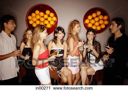 Young adults in night club View Large Photo Image Stock Image - Young adults in night club. Fotosearch