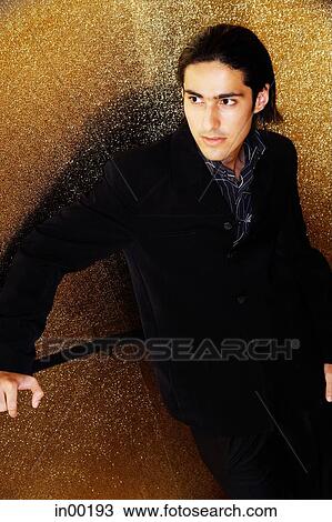 Young man dressed in suit, looking away View Large Photo Image Stock Image - Young man dressed in suit, looking away. Fotosearch