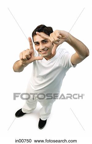 Young man looking up at camera, making hand sign, "L" View Large Photo Image Stock Image - Young man looking up at camera, making hand sign, "L". Fotosearch