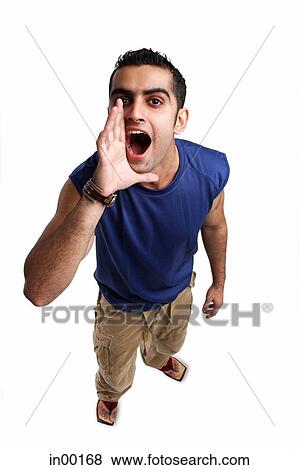 Young man looking up at camera, shouting View Large Photo Image Stock Photo - Young man looking up at camera, shouting. Fotosearch