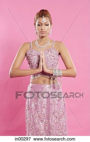 Young woman in Indian costume, hands together, eyes closed View Large Photo Image Stock Photo - Young woman in Indian costume, hands together, eyes closed. Fotosearch