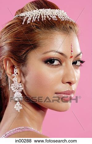 Young woman in Indian costume, looking at camera, sideways glance View Large Photo Image Stock Photo - Young woman in Indian costume, looking at camera, sideways glance. Fotosearch