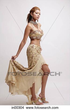 Young woman in Indian costume, posing View Large Photo Image Picture - Young woman in Indian costume, posing. Fotosearch