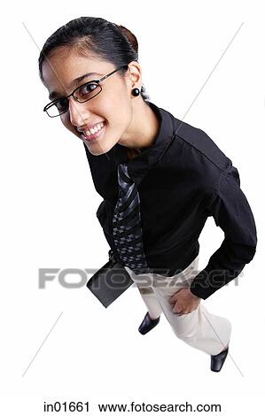 Business woman smiling at camera, high angle view View Large Photo Image Stock Image - Business woman smiling at camera, high angle view. Fotosearch