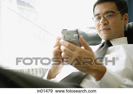 Businessman with PDA View Large Photo Image Stock Photo - Businessman with PDA. Fotosearch