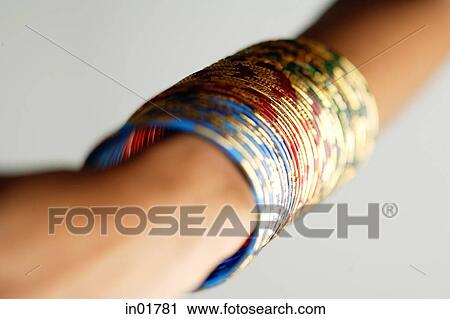 Close-up of woman's arm with colourful bangles View Large Photo Image Stock Image - Close-up of woman's arm with colourful bangles. Fotosearch