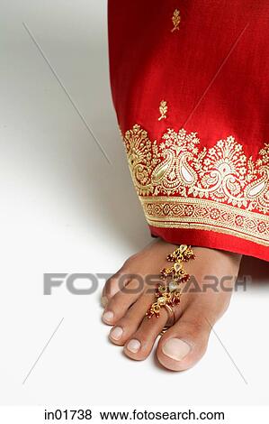 Close-up of woman's feet with traditional Indian toe ring View Large Photo Image Stock Photo - Close-up of woman's feet with traditional Indian toe ring. Fotosearch