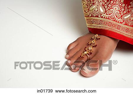 Close-up of woman's feet with traditional Indian toe ring View Large Photo Image Stock Photo - Close-up of woman's feet with traditional Indian toe ring. Fotosearch