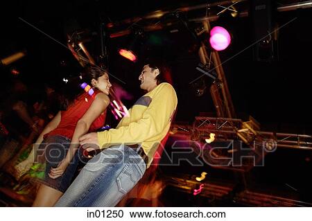 Couple dancing in night club, low angle view View Large Photo Image Stock Image - Couple dancing in night club, low angle view. Fotosearch