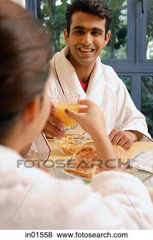 Couple having breakfast at home View Large Photo Image Stock Photo - Couple having breakfast at home. Fotosearch