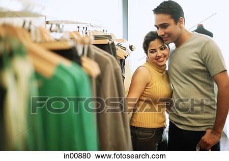 Couple in clothing store View Large Photo Image Stock Image - Couple in clothing store. Fotosearch