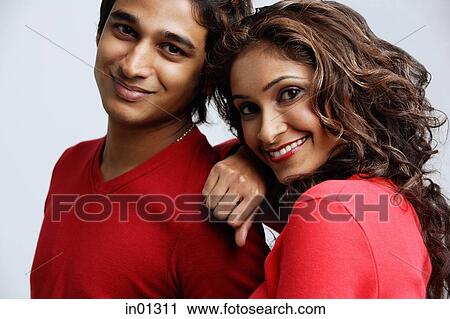 Couple looking at camera, smiling, portrait View Large Photo Image Stock Image - Couple looking at camera, smiling, portrait. Fotosearch