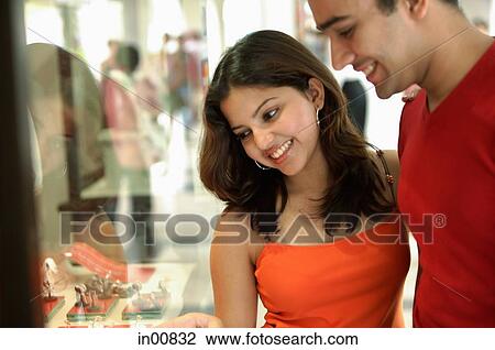 Couple window shopping View Large Photo Image Stock Image - Couple window shopping. Fotosearch