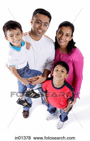 Family of four looking at camera View Large Photo Image Stock Photo - Family of four looking at camera. Fotosearch