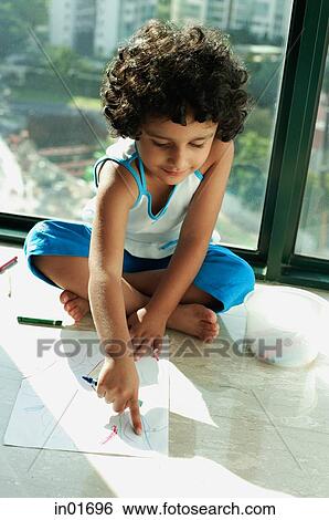 Girl sitting on floor with crayons and paper, pointing to drawing View Large Photo Image Stock Photograph - Girl sitting on floor with crayons and paper, pointing to drawing. Fotosearch