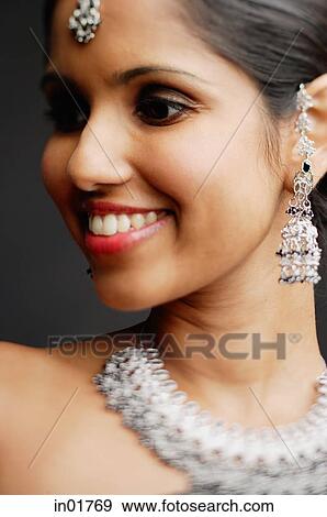Head shot of woman with Indian jewellery View Large Photo Image Stock Photo - Head shot of woman with Indian jewellery. Fotosearch