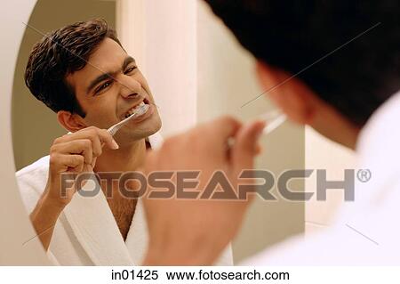 Man brushing his teeth View Large Photo Image Stock Photography - Man brushing his teeth. Fotosearch