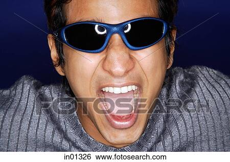 Stock Photograph - Man in sunglasses, shouting. Fotosearch