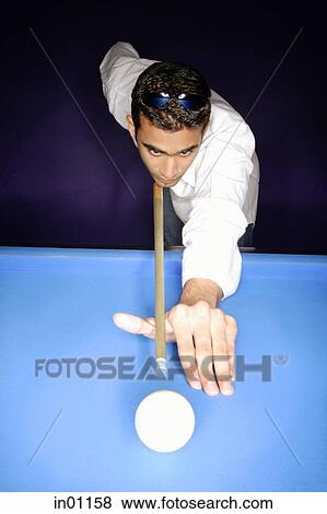 Stock Photo - Man playing pool. Fotosearch