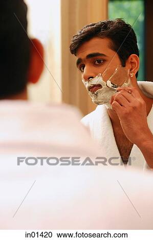 Man shaving his face View Large Photo Image Stock Image - Man shaving his face. Fotosearch